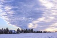 Winter Scene: Striation clouds at sunset in the countryside of Bavaria