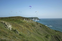Paragliding over the coast and ocean in Normandy