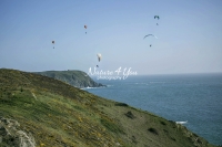 Paragliding over the coast and ocean in Normandy