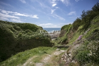 Country path in a green valley towards the ocean in Normandy